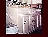 White Painted Double Sink Vanity Cabinet. Flat Panel Full Overlay door style.