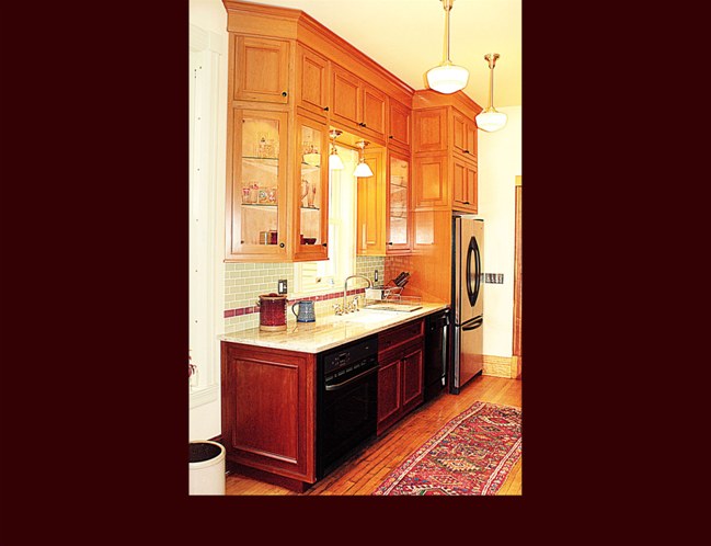 Cherry Kitchen Cabinetry. Flat panel door style with applied moulding.