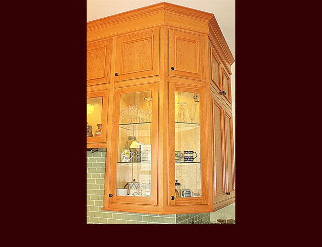 Cherry Kitchen Cabinets. Two tiered upper wall cabinets. 10' ceiling height.